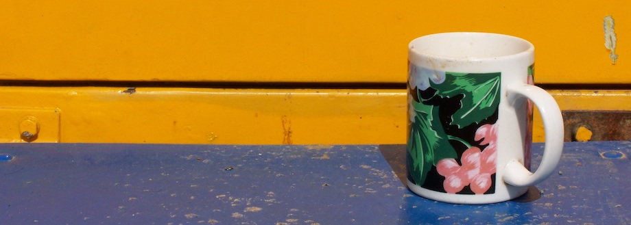 Colourful mug on blue and yellow — The Lonely Cup